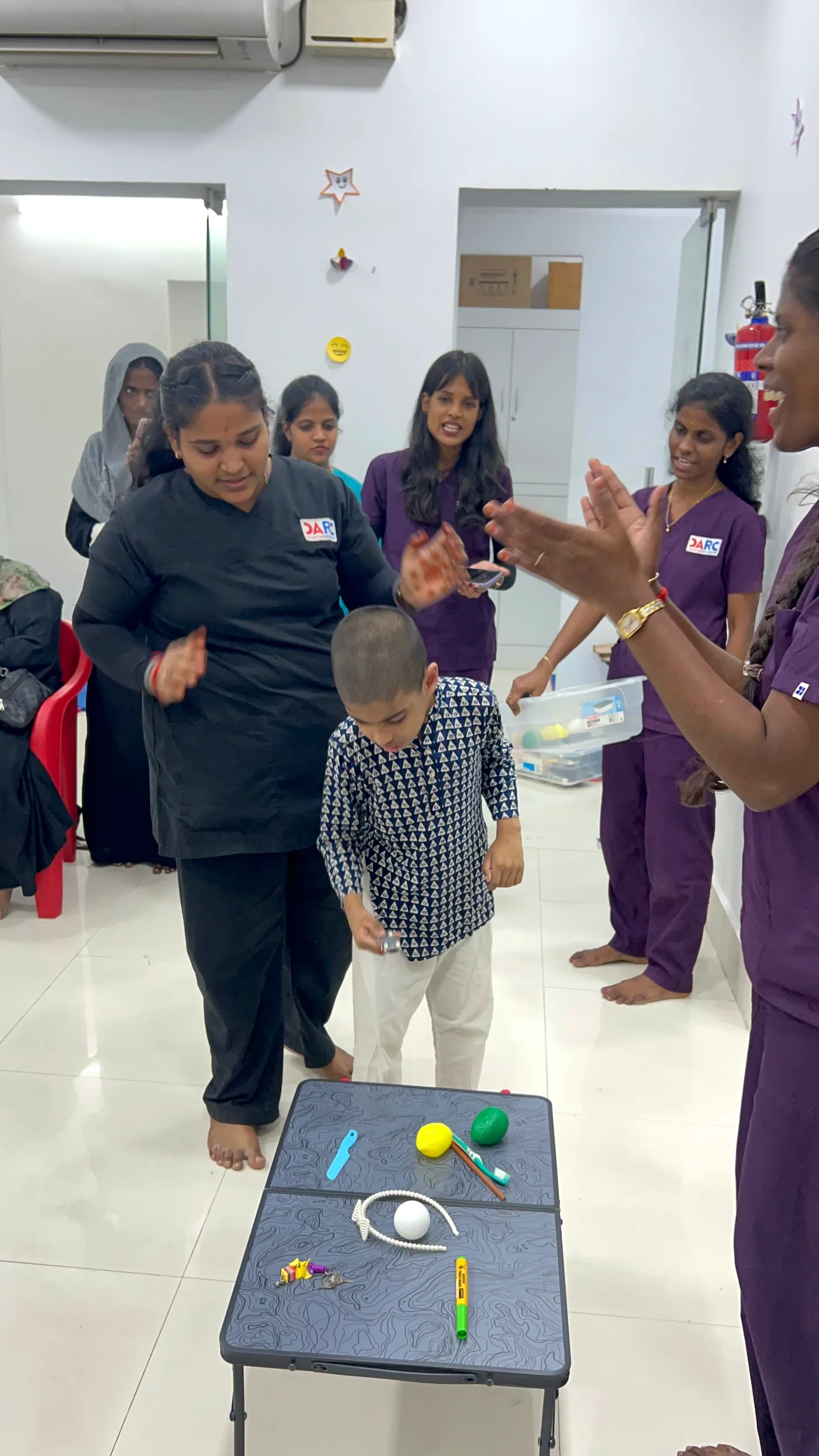 DARC special educator supporting a child with structured learning activities