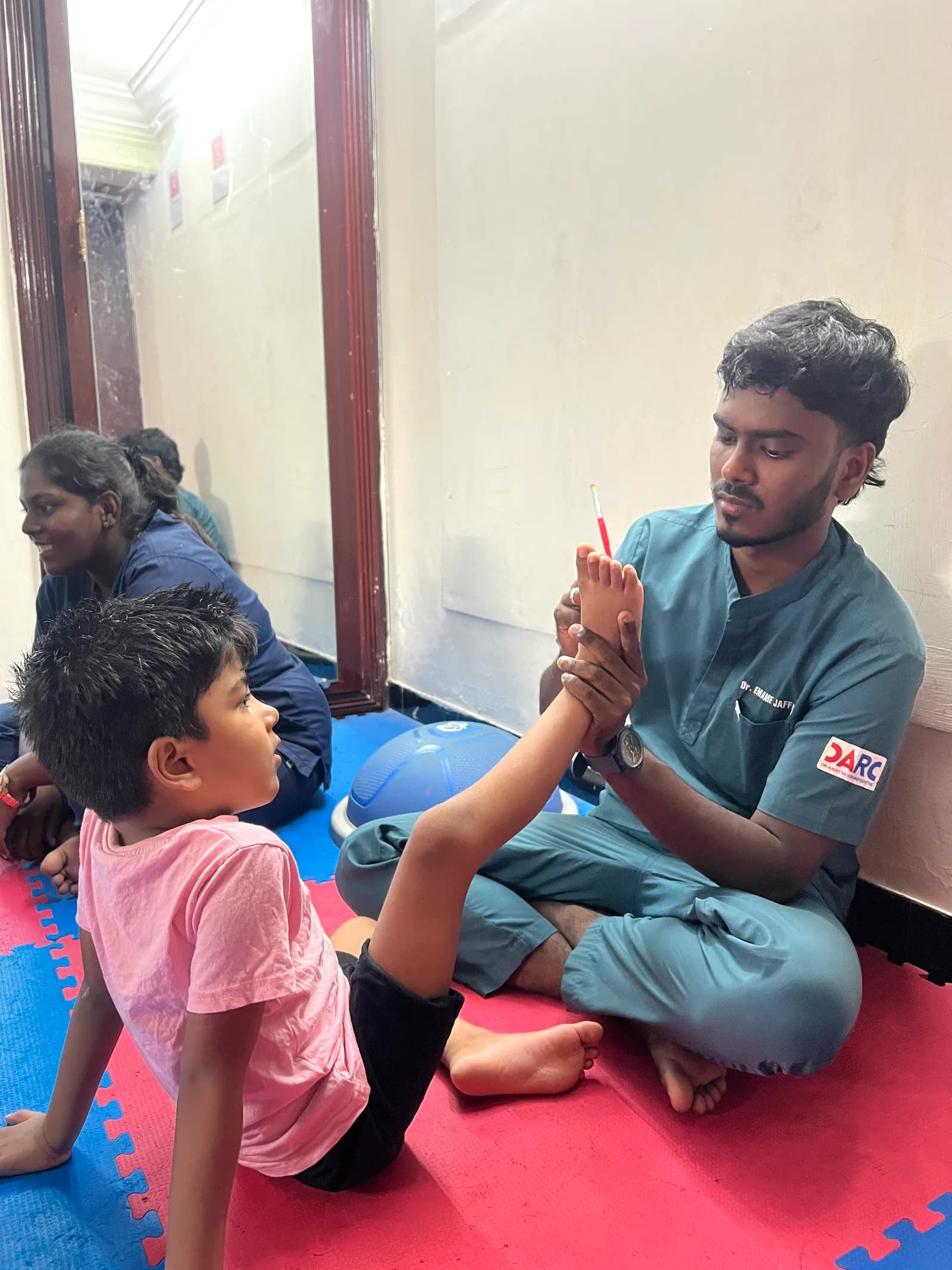 Dr. Aaditya Malathy leading a sensory integration therapy session at DARC