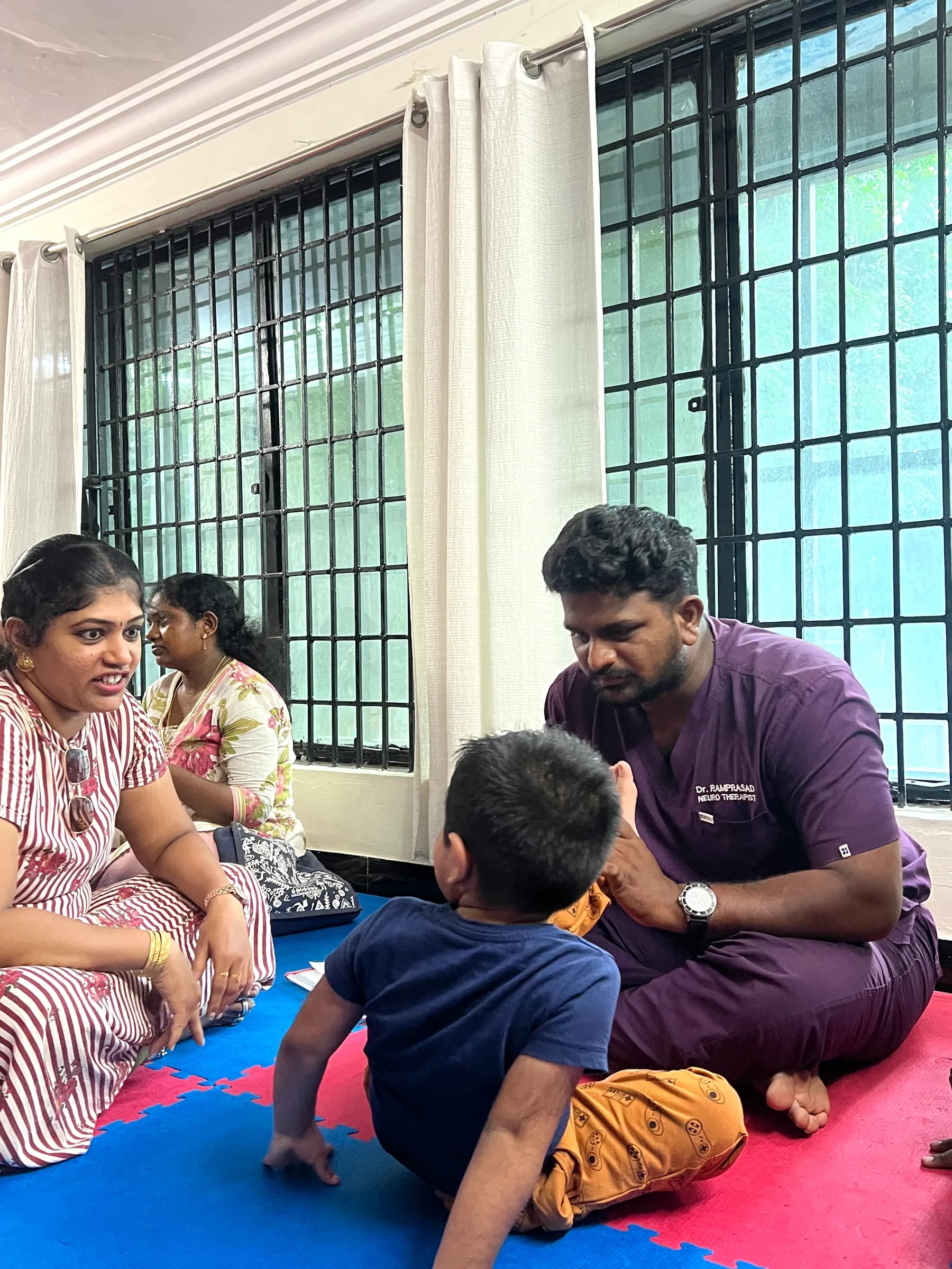 DARC team discussing sensory diet strategies with a parent