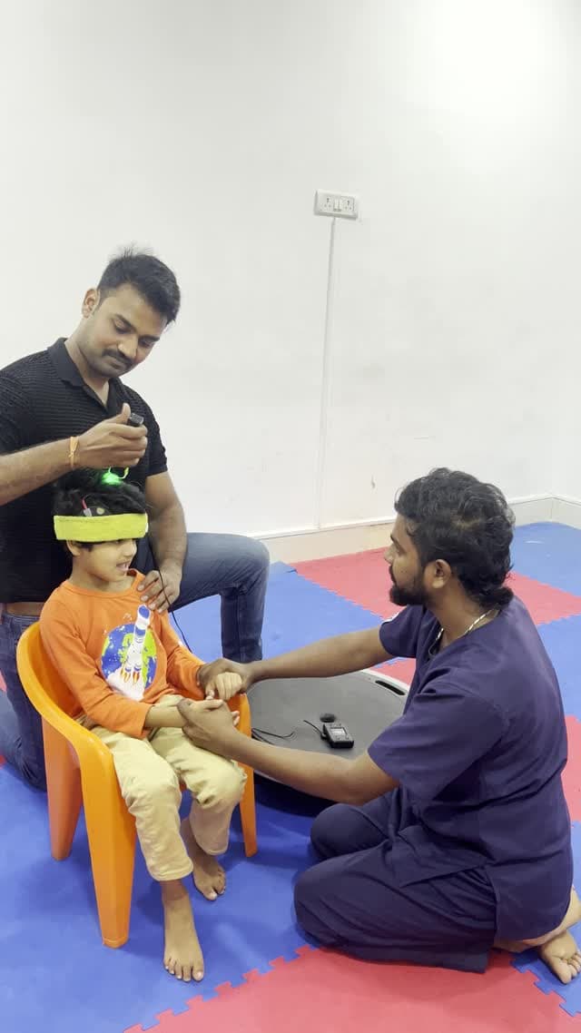 DARC team supervising a child during a photobiomodulation support session
