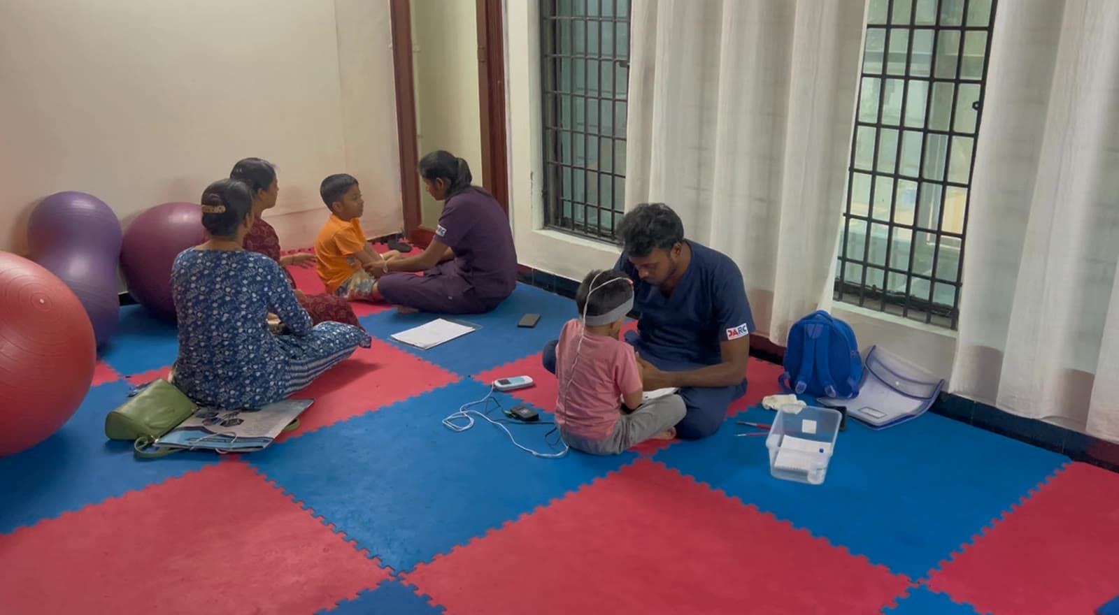 DARC paediatric therapy room in Chennai with therapists supporting children